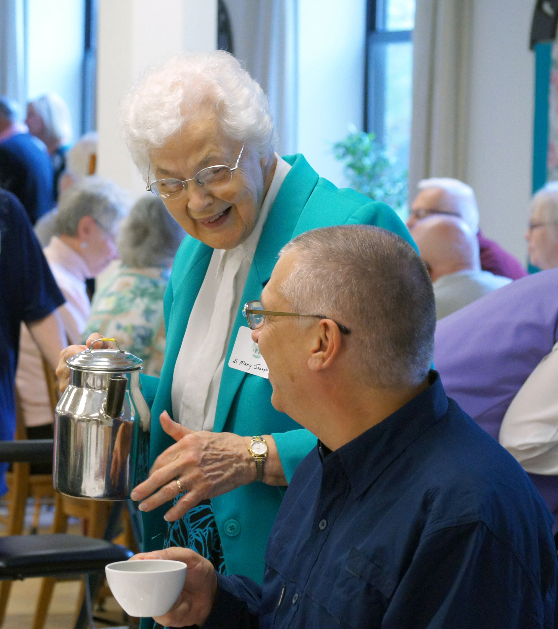 Sister Mary Josephine Torborg pours coffee at the Monastery Open House.