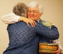 Sister Joan Marie Stelman gives Sister Lois a Magic Coupon for Visiting Family