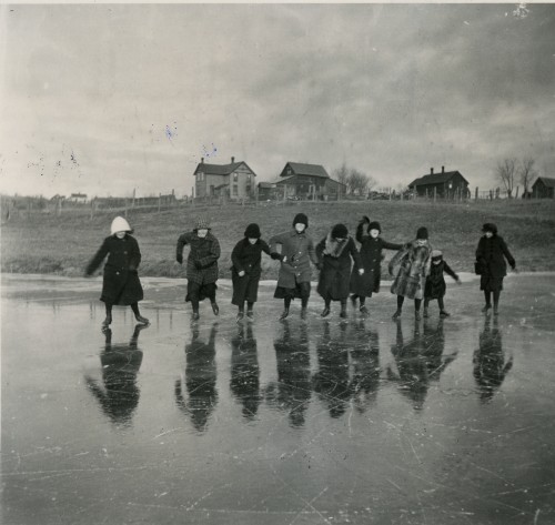 Students skating on the pond