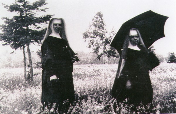 Sister Pauline Dunphy and Mother Scholastica Kerst, surveying the purchase of the “daisy farm.”