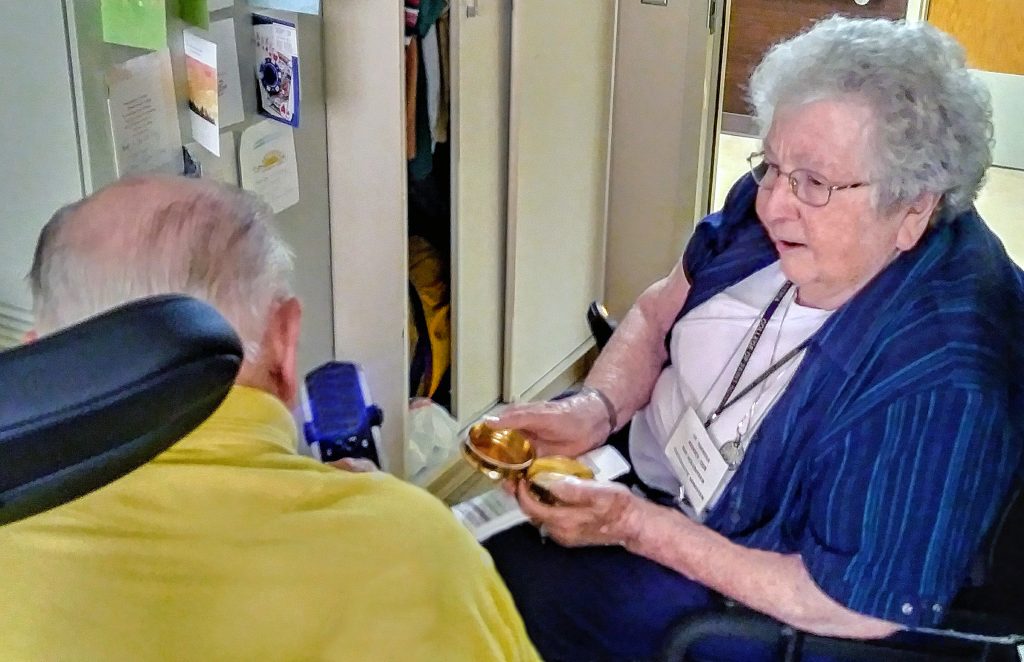 Sister Theresa Jodocy faithfully brings the consolation of the Body of Christ to residents at the Benedictine Living Community next door to the Monastery.