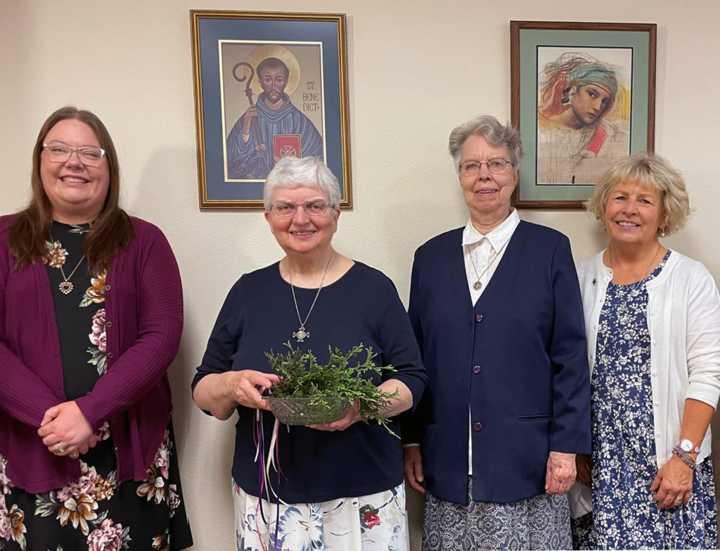 Sister Beverly Raway blessed the Monastery administrative offices and those newly selected: from left, Amber Terch, Administrative Assistant; Sister Beverly Raway, Prioress; Sister Jeanne Ann Weber, Sub Prioress; and Becky Urbanski, Interim Director of Mission.