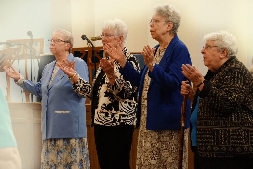 Sisters Luella, Jeanne Ann, Sue, and Renata pray the Suscipe.