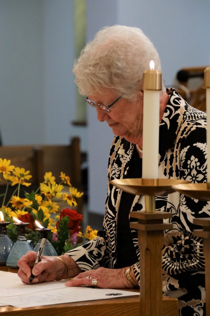 Each Sister reads her promises and the signs them on the altar, then the Prioress countersigns them.