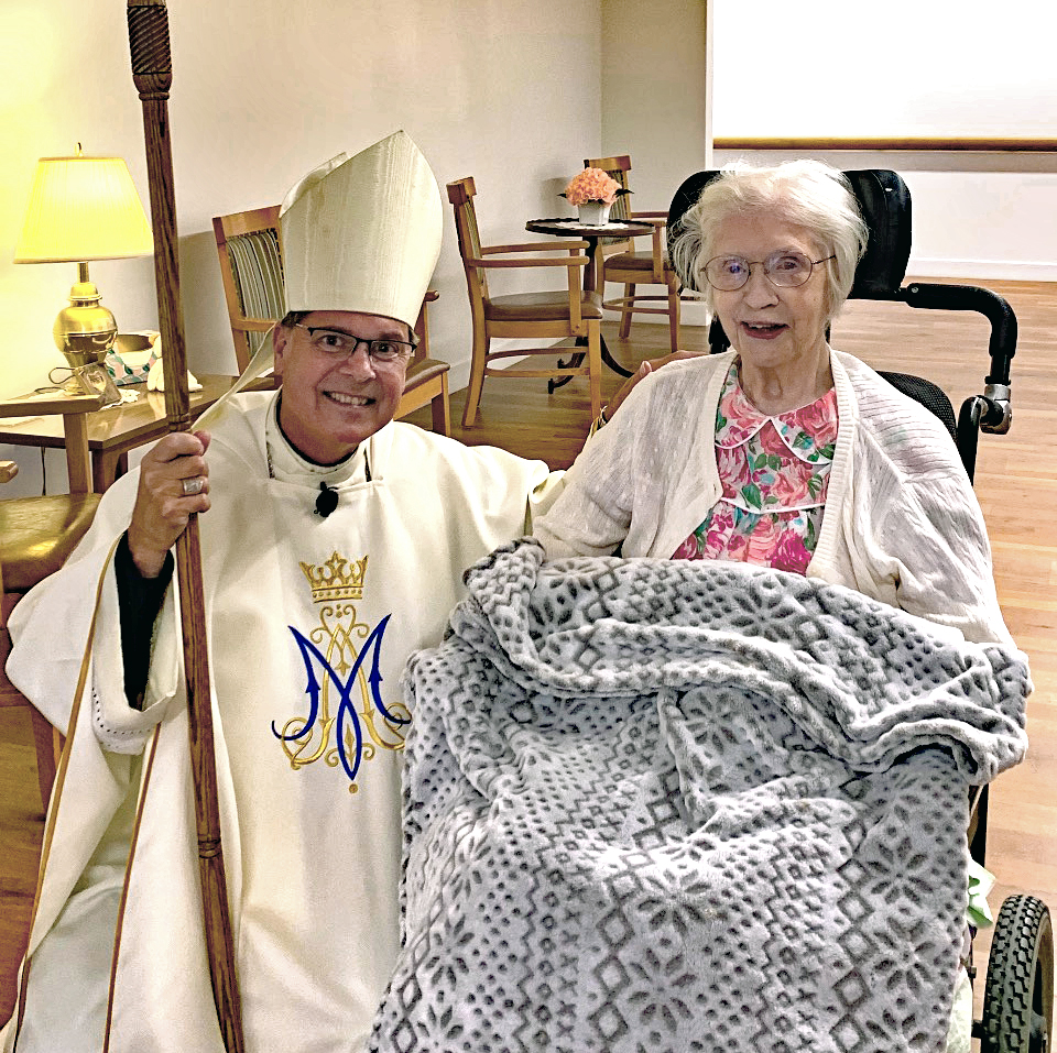 Bishop Daniel Felton visit Sister Johnetta Maher on her 80th jubilee.
