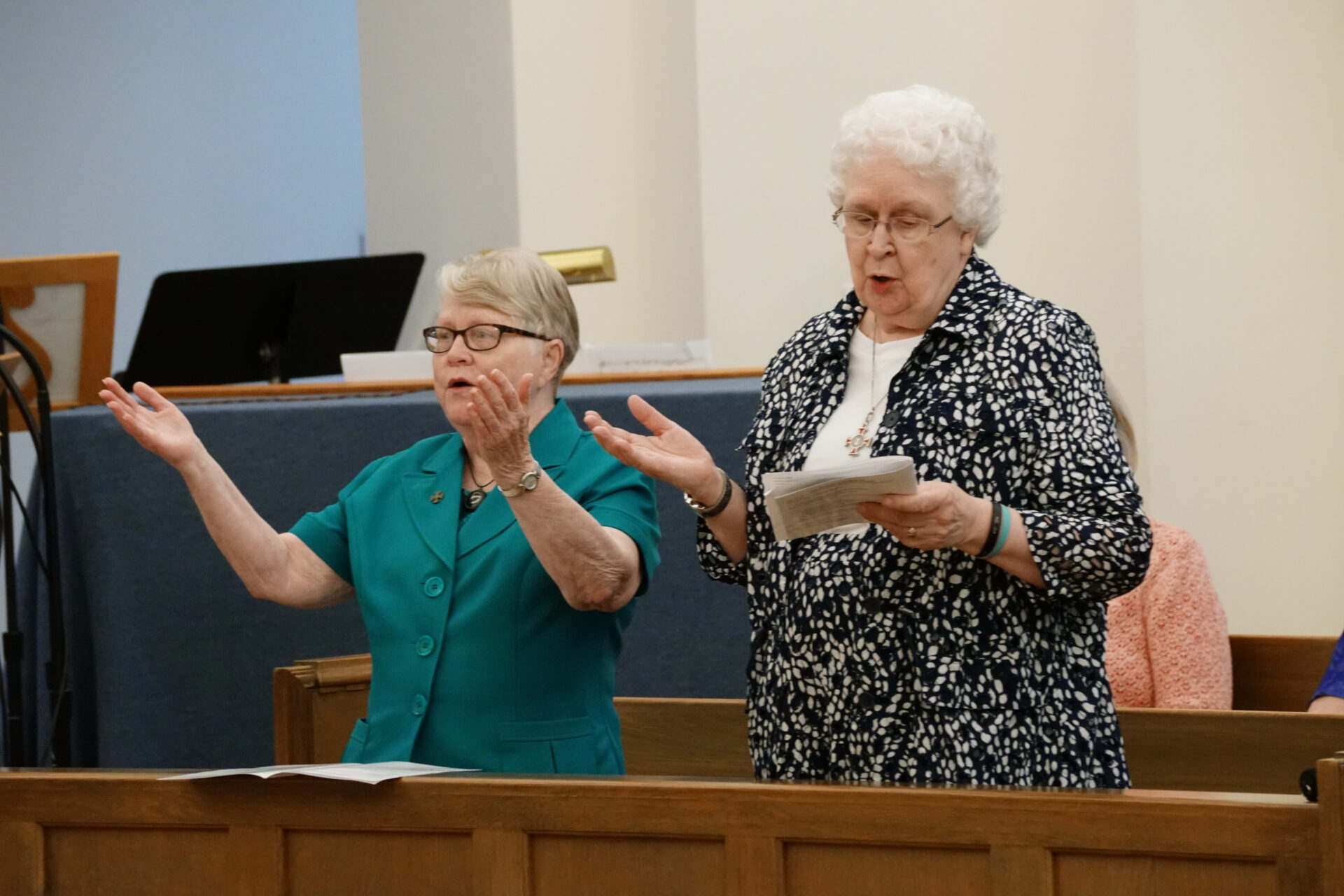 Sisters Mary Suan Dewitt and Lois Ann Glaudel sing the Suscipe, the prayer of renunciation